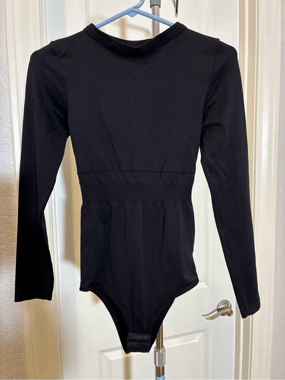 real Black Long-Sleeve One Piece Bodysuit with a Cut Out Back Womenโs Size M